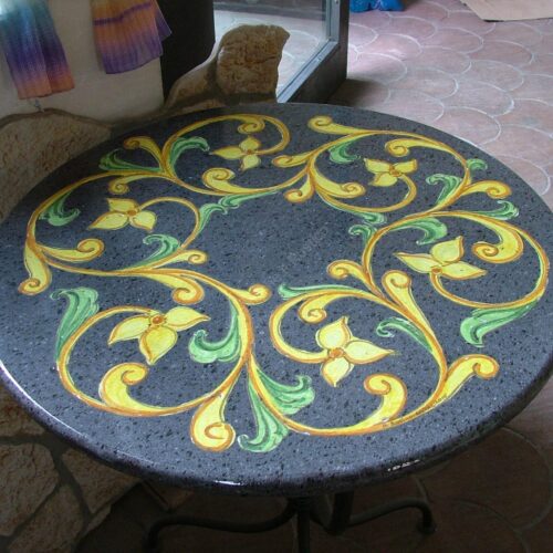 Round lava stone table "Ornato" in relief